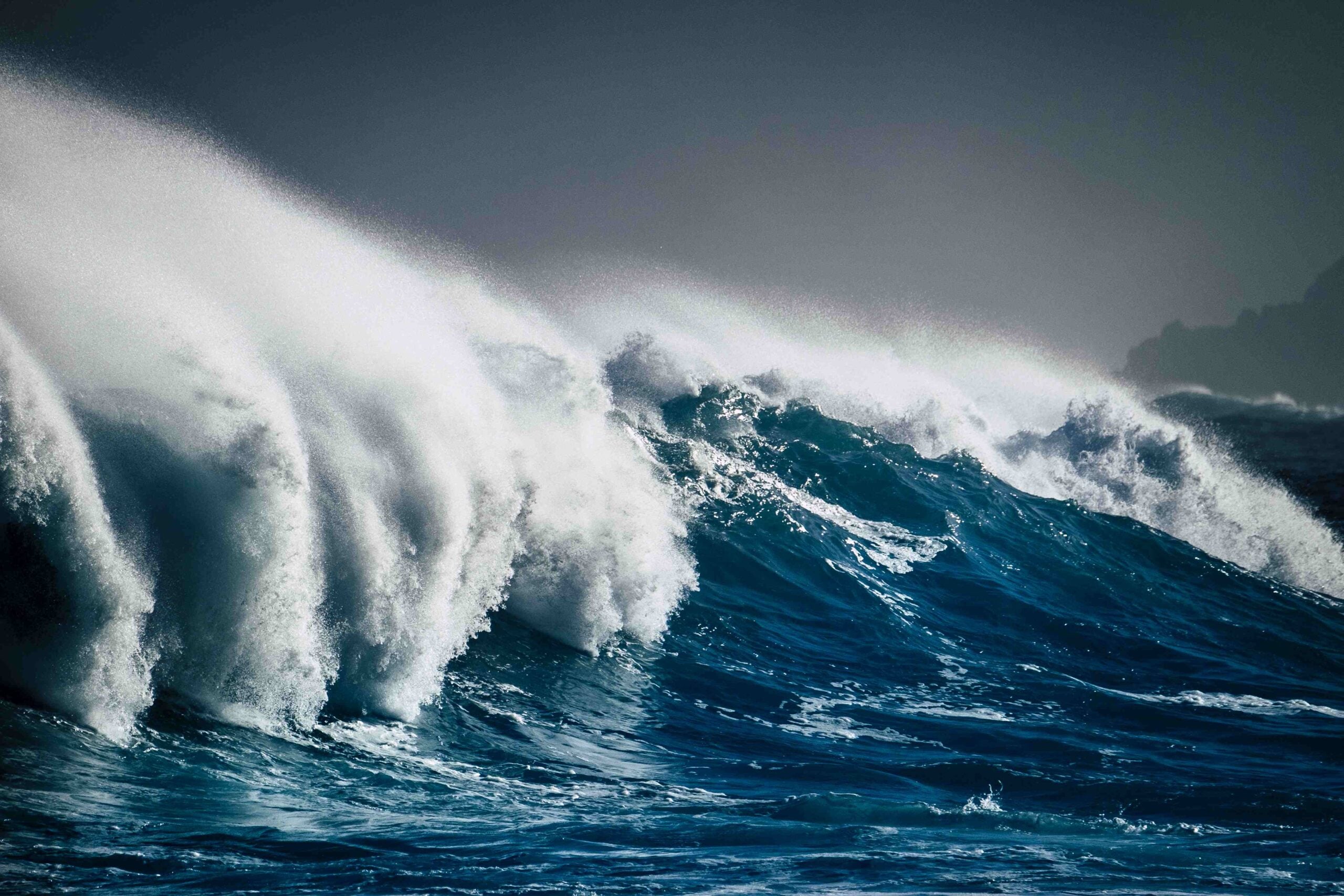 Dangerous powerful energy wave big splash white foam and blue de