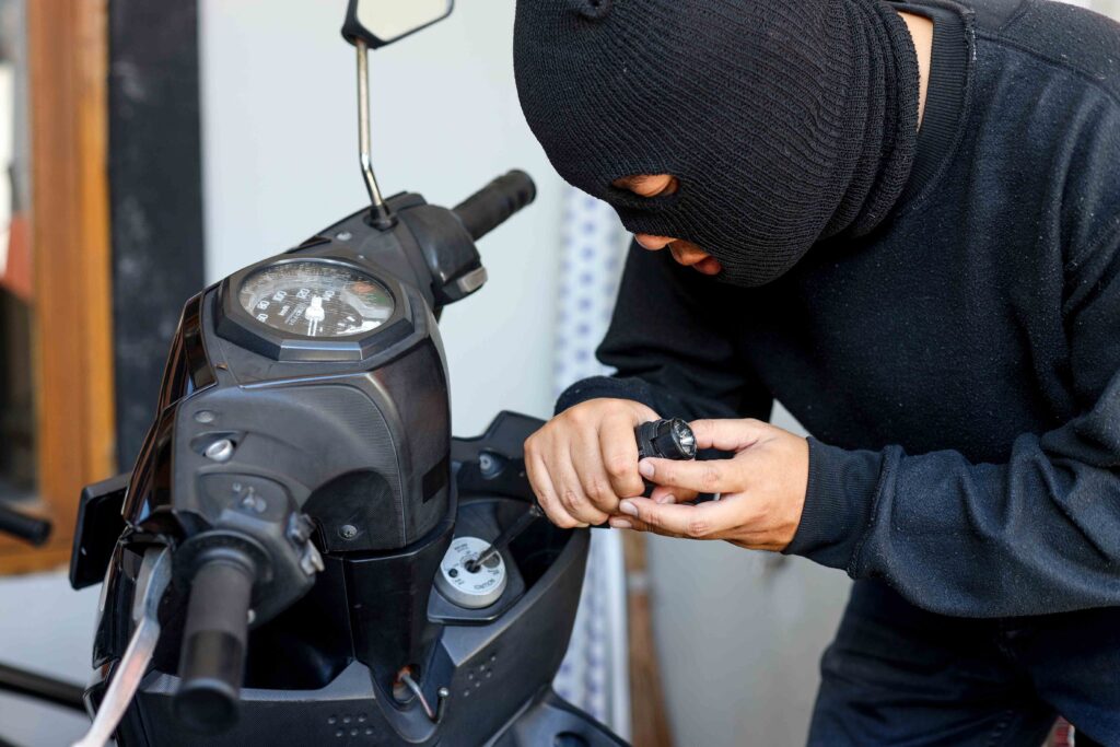 motorcycle thief in black mask trying to unlock th 2023 11 27 05 01 53 utc