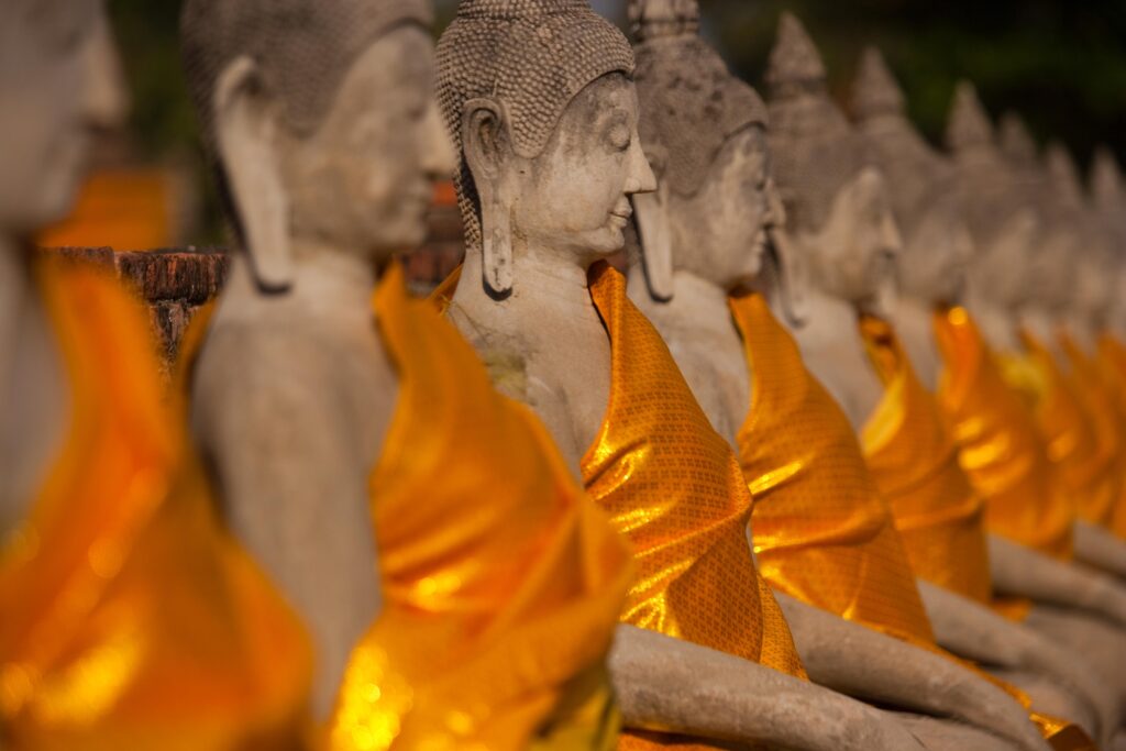 Wat Yai Chai Mongkon, a historic Buddhist temple Rows of seated Buddha statues, swathed in saffron robes