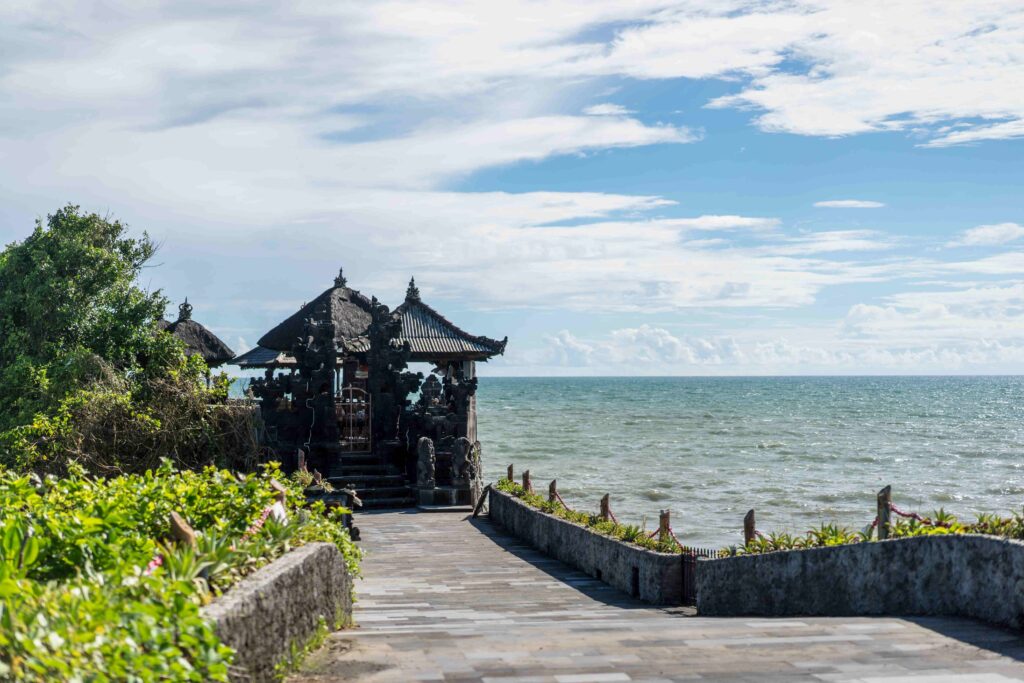 Scenic view of Tanah Lot Temple, ocean and cloudy sky, bali, indonesia