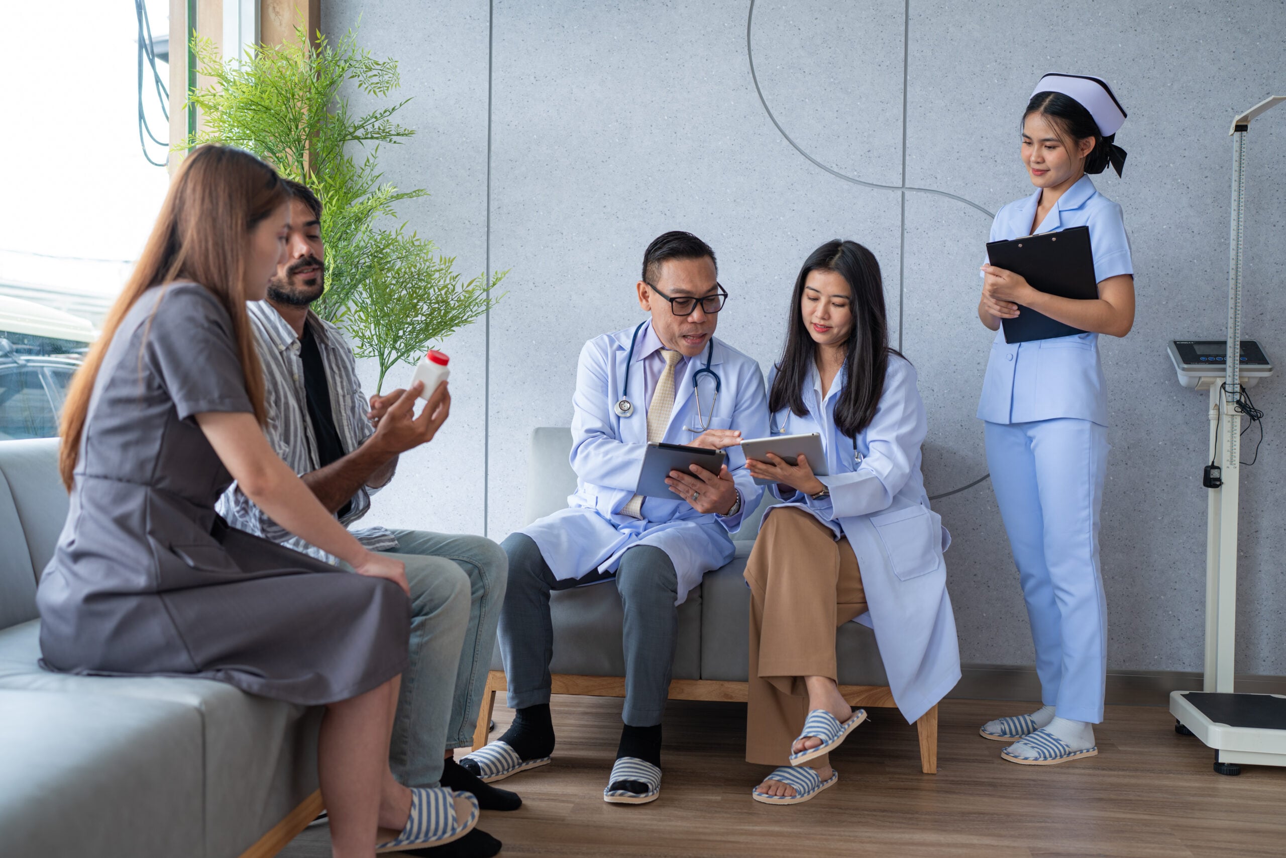 Team doctor taking care and talking couple patient