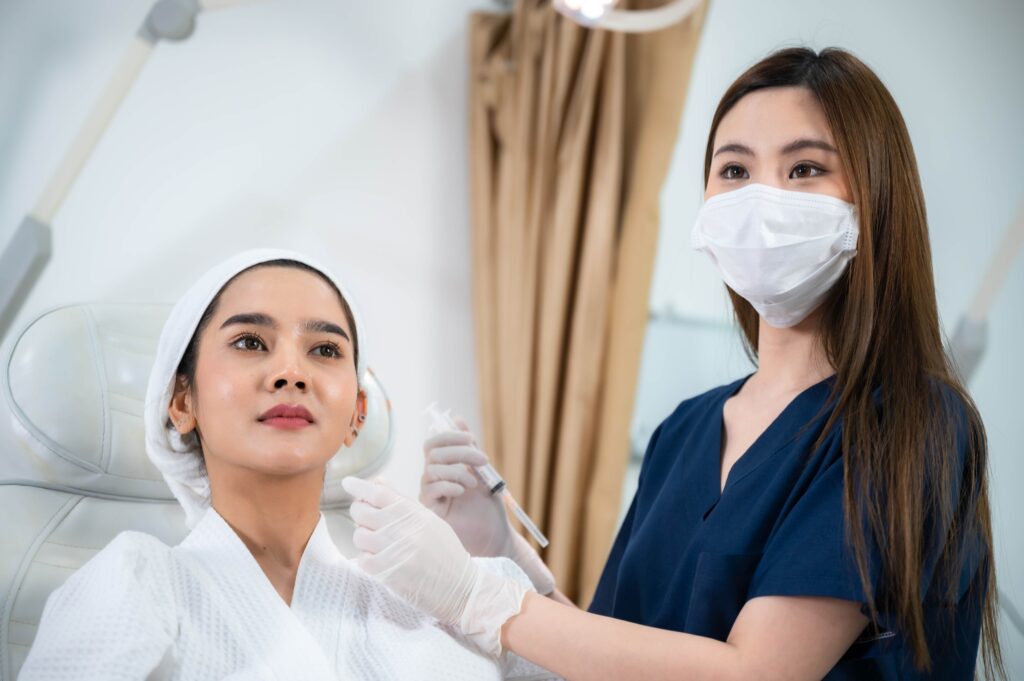 young Asian woman making cosmetology treatment skin injection, Mesotherapy of face beauty care