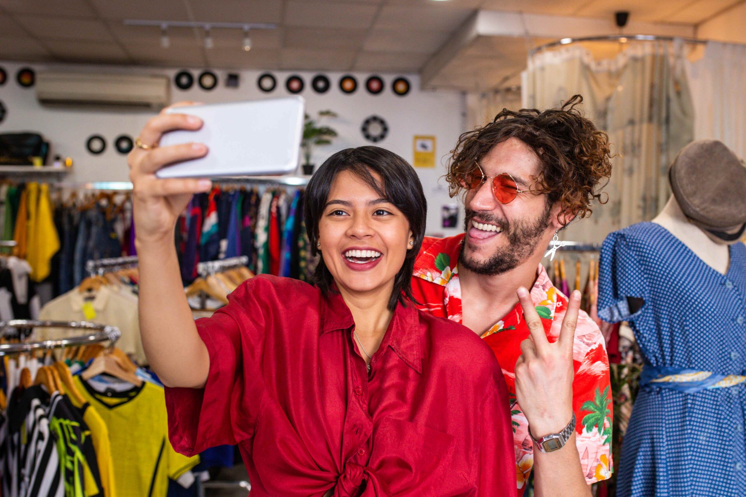 Young people taking selfie in shop