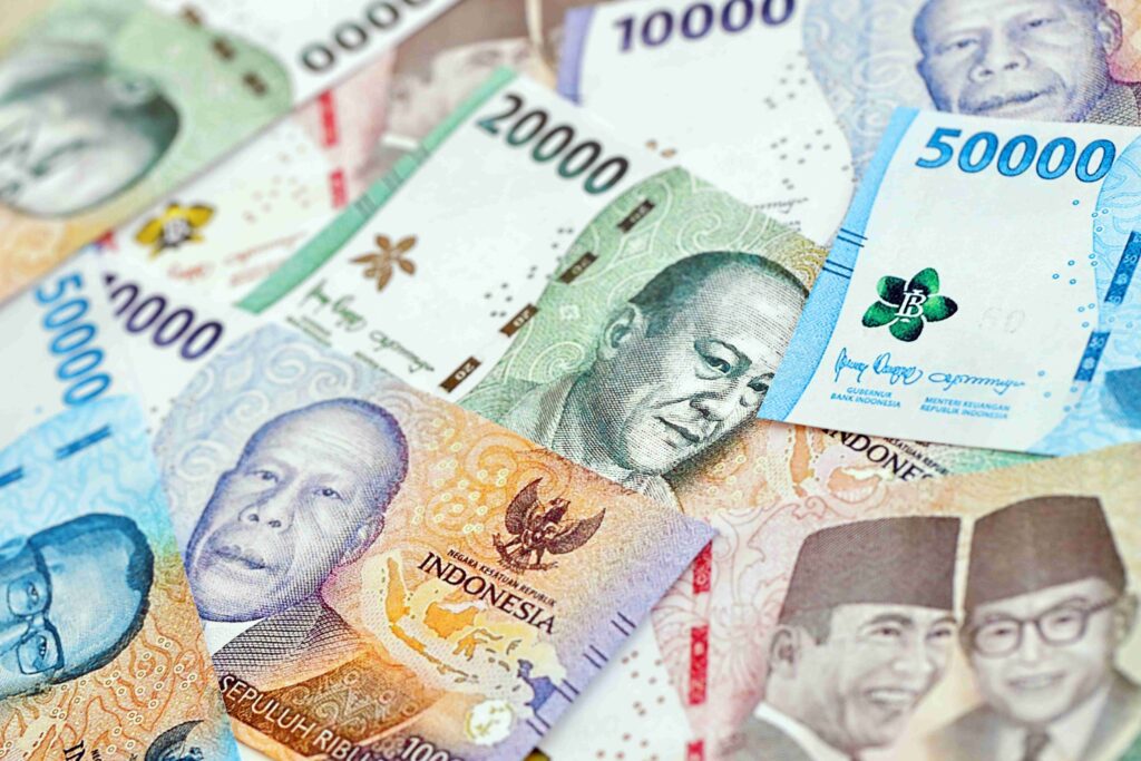 Background image of many indonesian rupiah money bills of new series