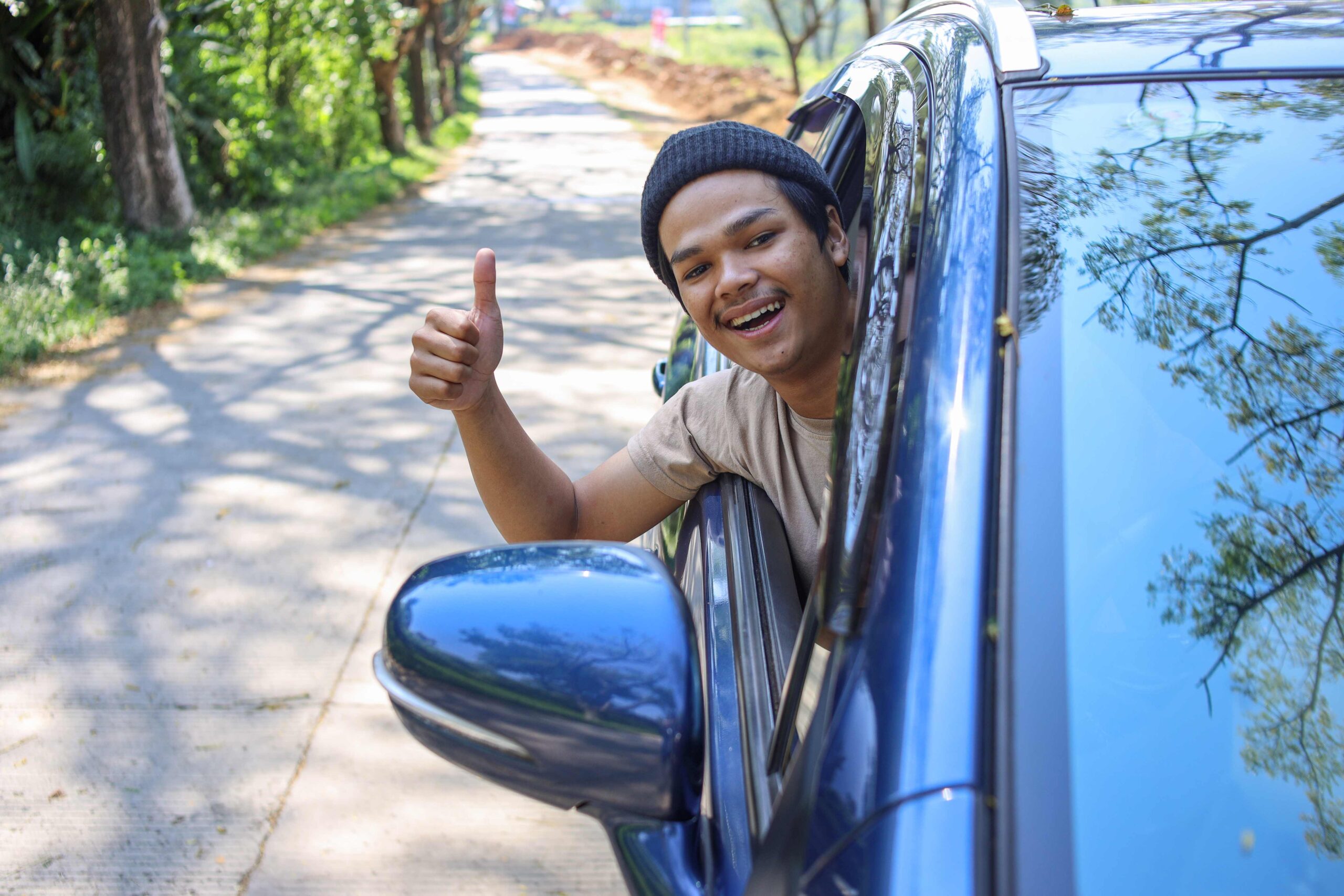 man showing thumb up on car 2023 11 27 04 58 08 utc