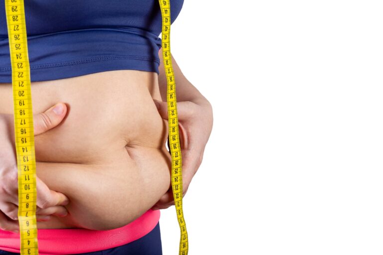 Overweight woman with measuring tape showing belly fat, horizontal, copy space, isolated on white