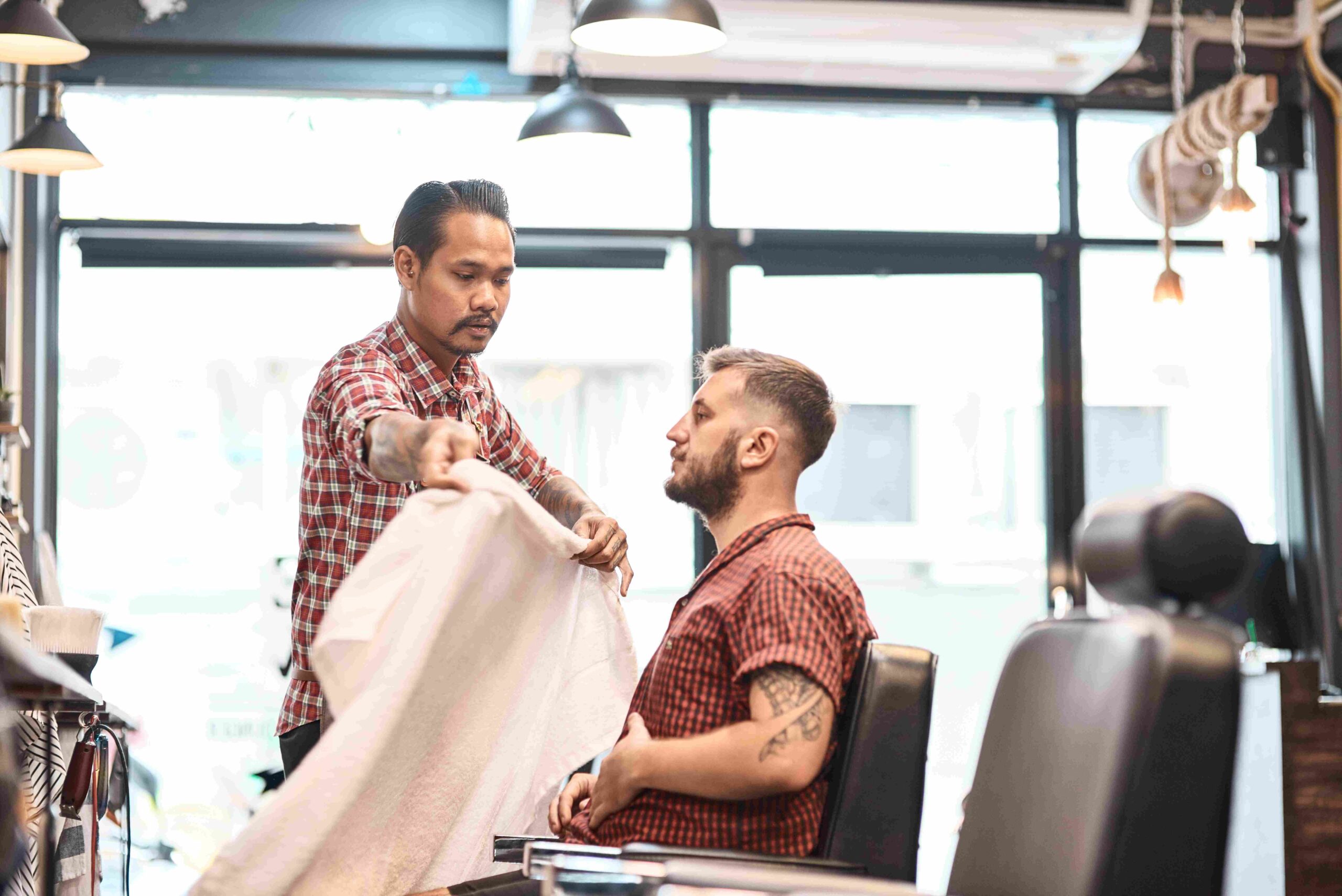 professional barber wearing a cape on his regular 2023 11 27 05 29 04 utc