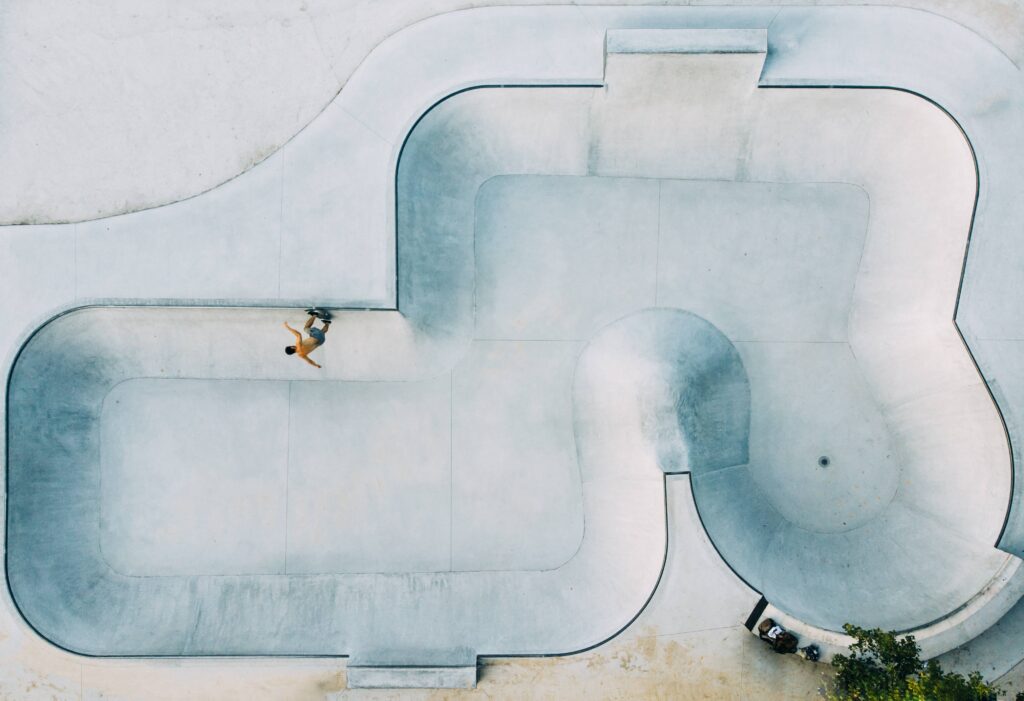 Skate park with men riding bicycles