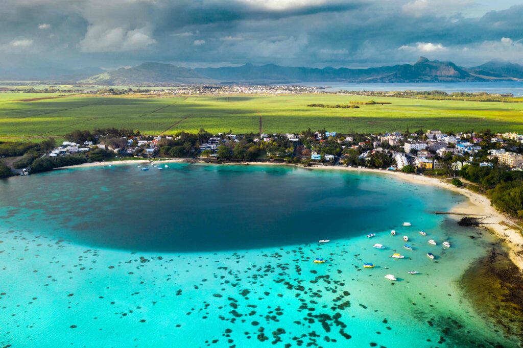 Top view of the Blue Bay lagoon of Mauritius A boat floats on a turquoise lagoon