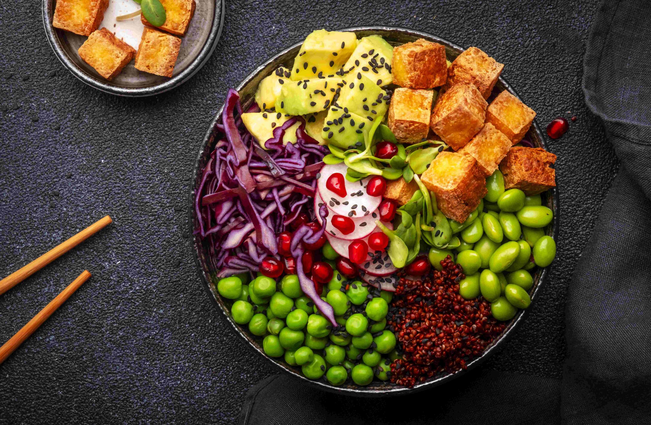 Vegan Buddha Bowl for balanced diet with roasted tofu, red quino