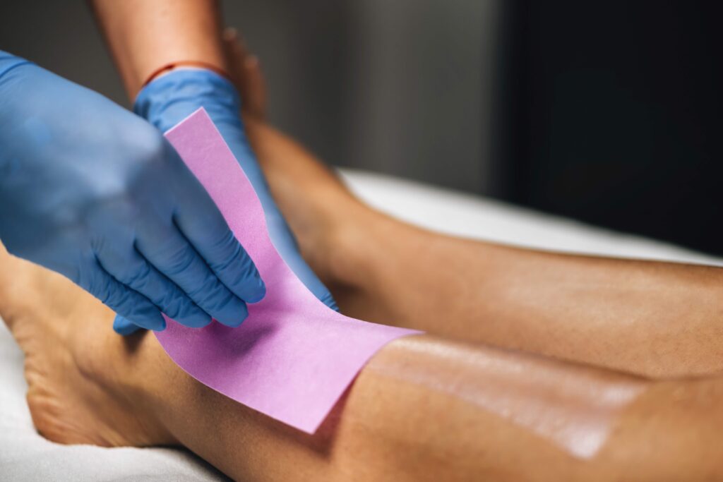 Waxing Legs Procedure in a Beauty Center