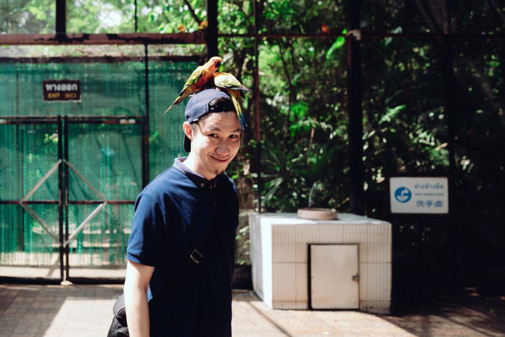 happy man with birds on his head 2023 11 27 05 06 59 utc