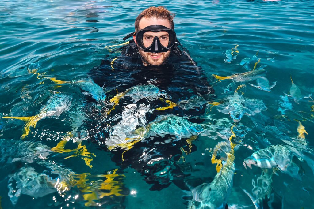 portrait of an underwater photographer above the water