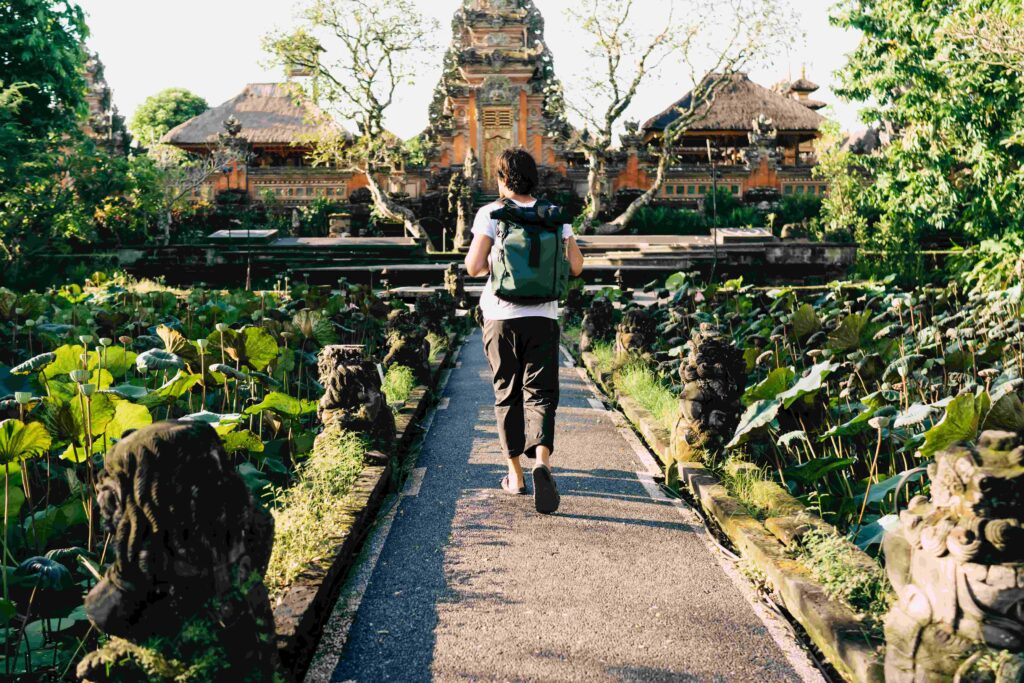 Man sightseeing oriental Water Palace temple in Bali