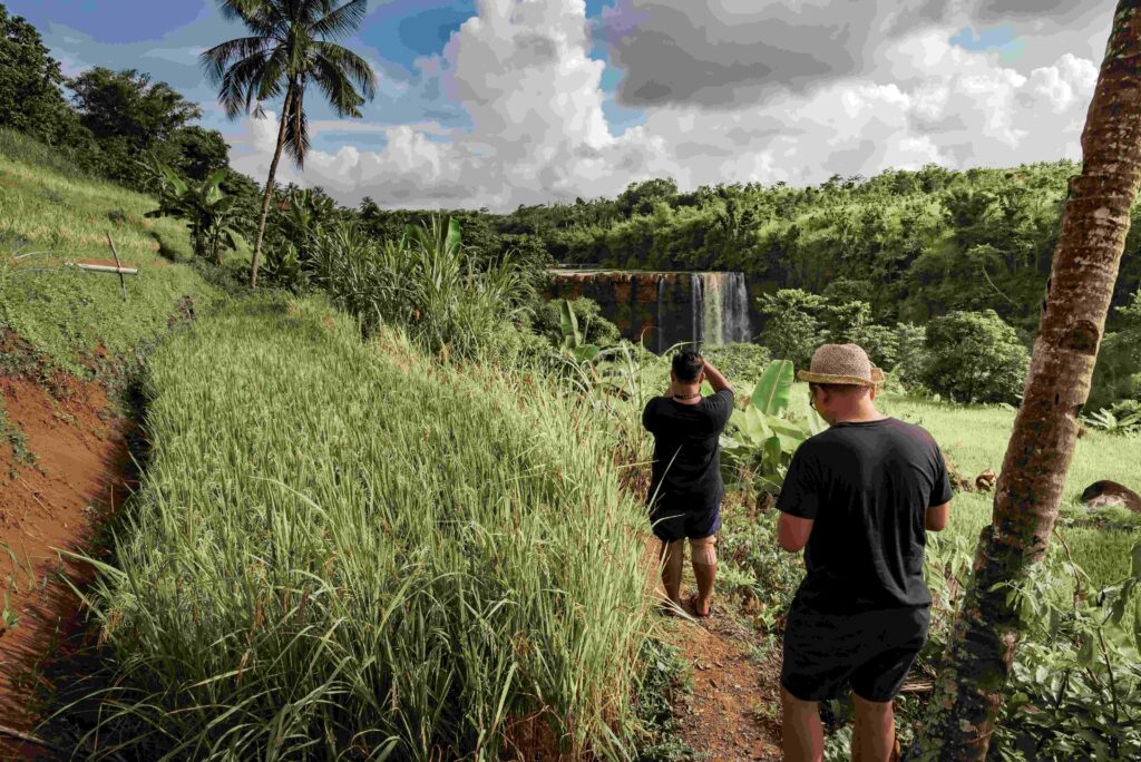 two men walking heading to the waterfall 2023 11 27 05 21 15 utc