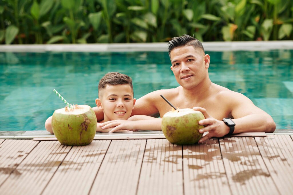 Father and son in swimming pool