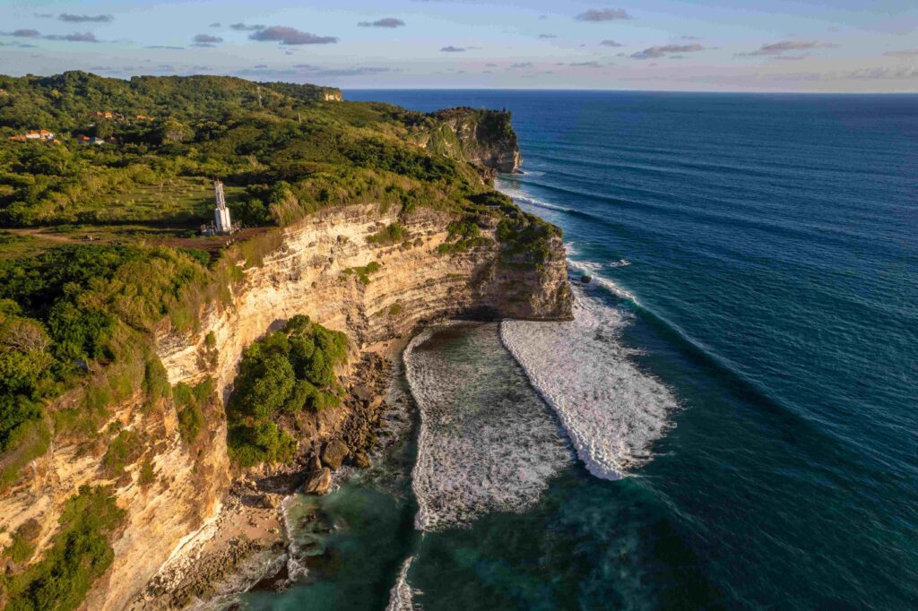 Rocky cliff coastline and ocean, sea, near Uluwatu temple in Bali, Indonesia