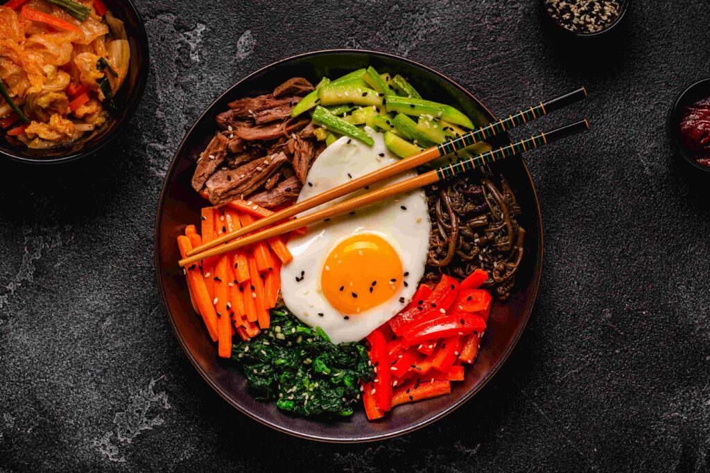 Traditional Korean dish Bibimbap: rice with vegetables beef and