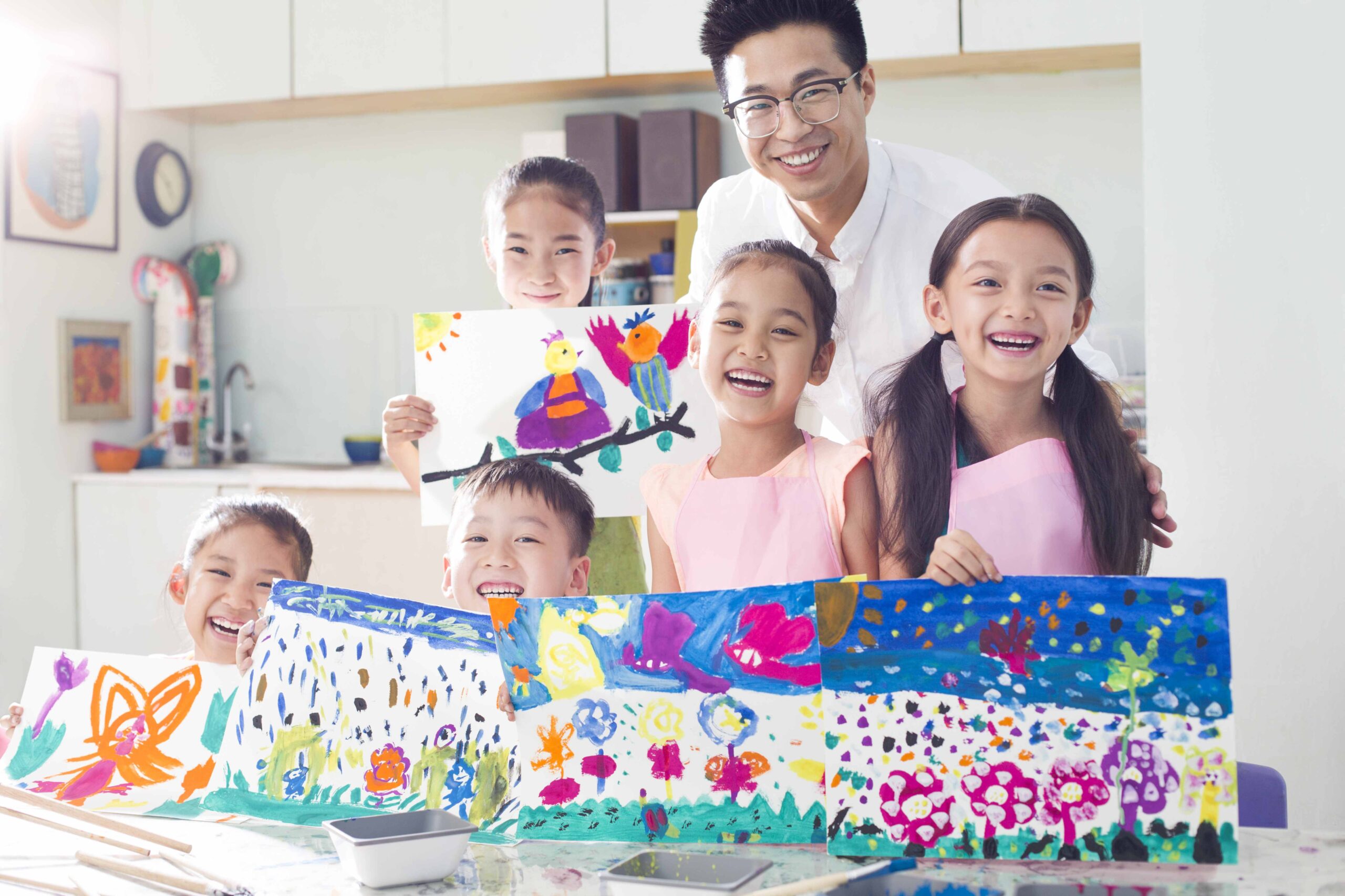 Little Chinese children in art class with teacher