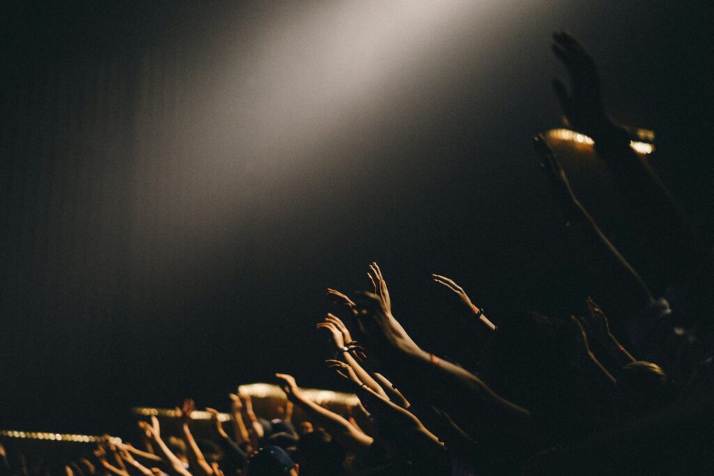 group-of-people-waving-their-hands