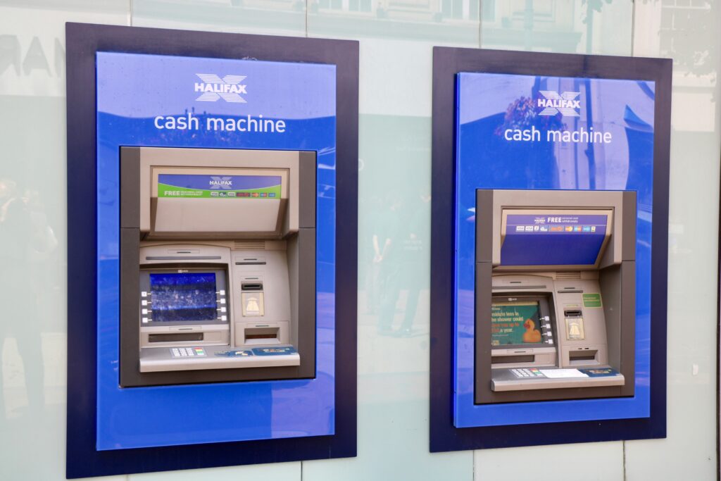 two-blue-and-black-halifax-cash-machines