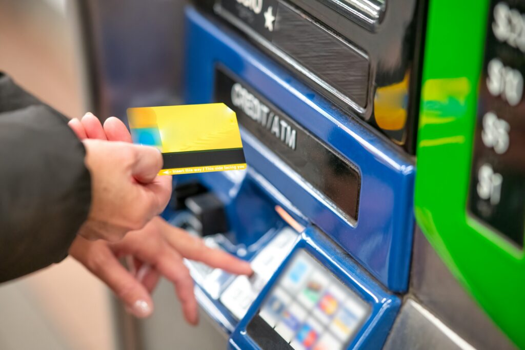 a-person-using-a-credit-card-to-pay-for-a-machine