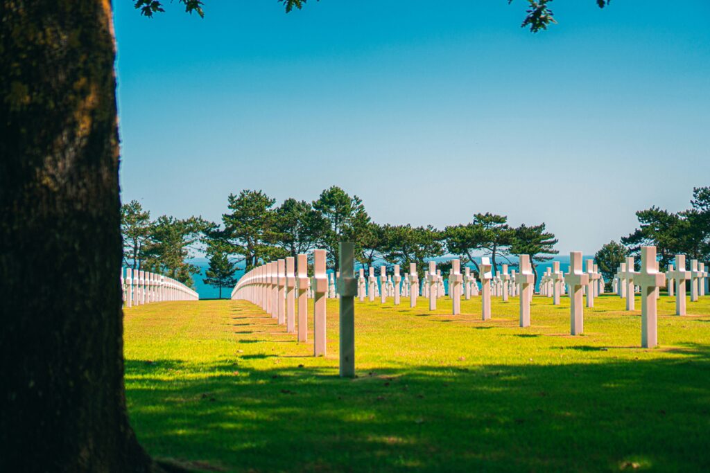 white-wooden-fence-on-green-grass-field-during-daytime