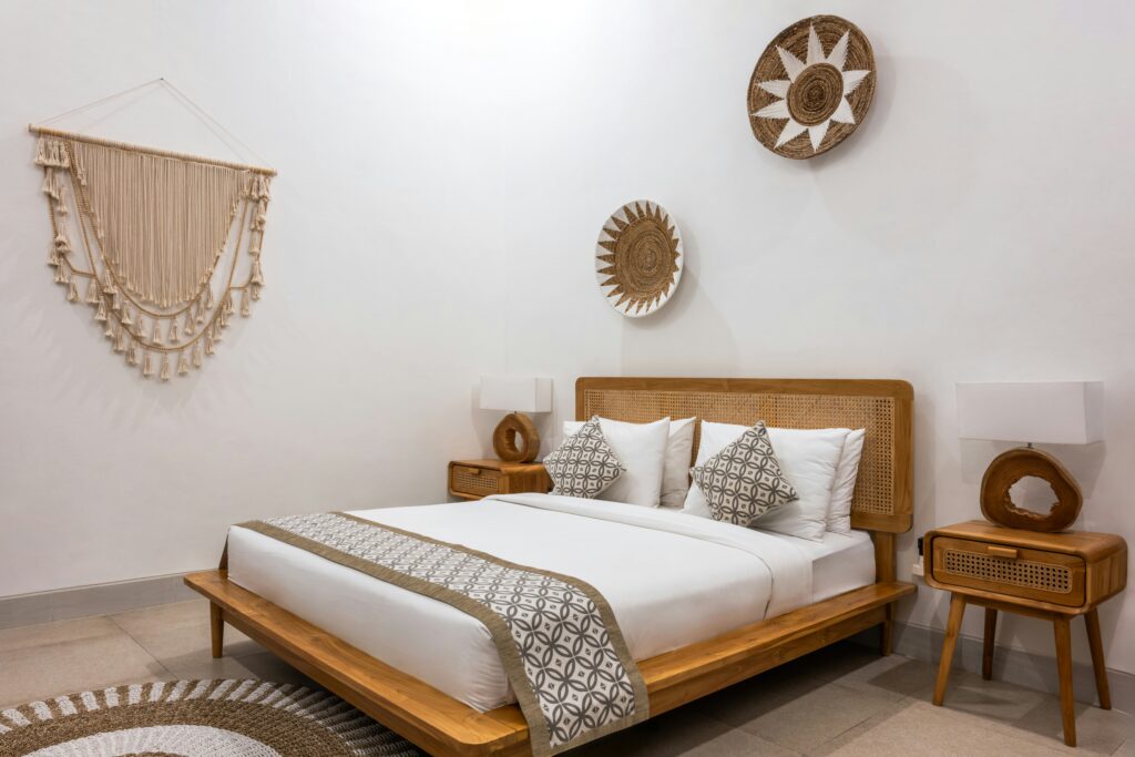 a-bed-room-with-a-neatly-made-bed-and-a-table