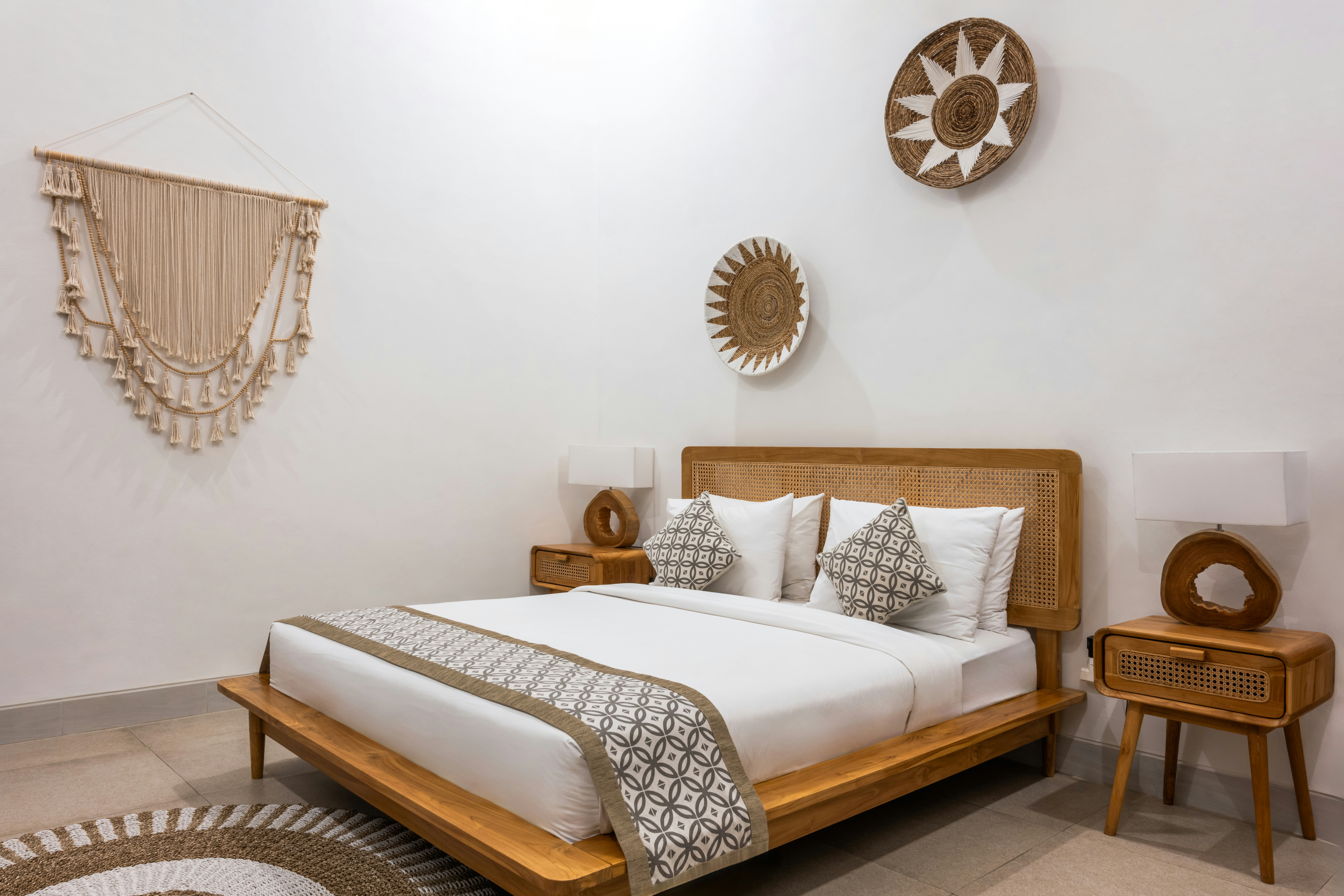 a-bed-room-with-a-neatly-made-bed-and-a-table