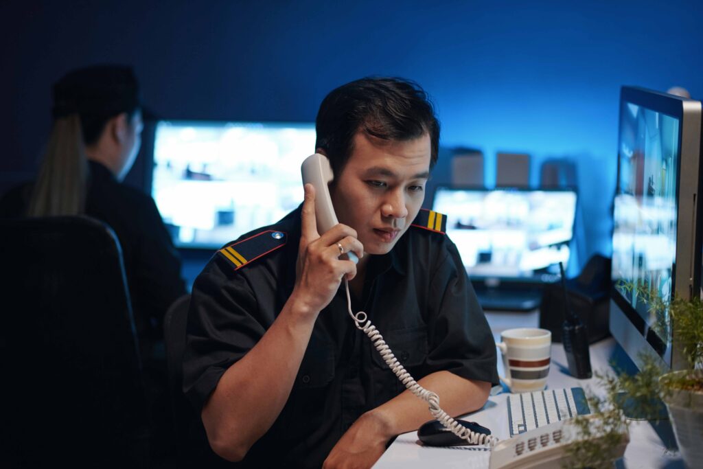 Security Worker Talking By The Phone