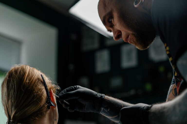 piercing studio a master pierces a girl s ear 2024 11 26 21 44 21 utc