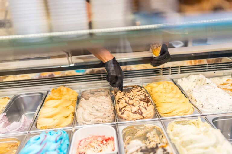 worker picking ice cream from counter of a store 2024 12 10 03 15 41 utc