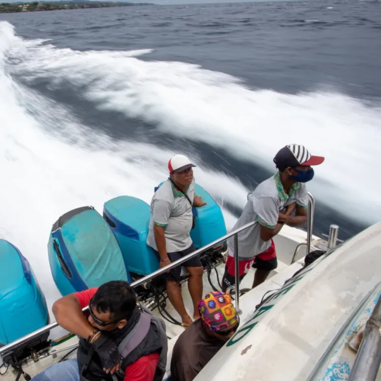 Bali Boat Crew Stand At Edge Of Speed Boat jpg