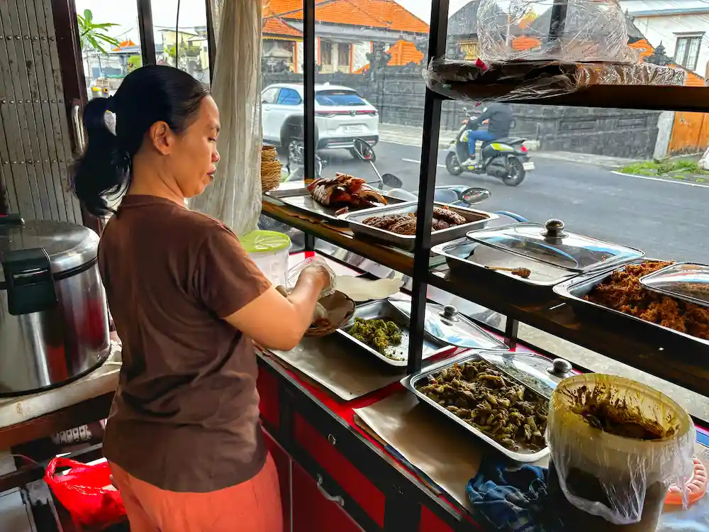 vendor serving food at warungs in bali