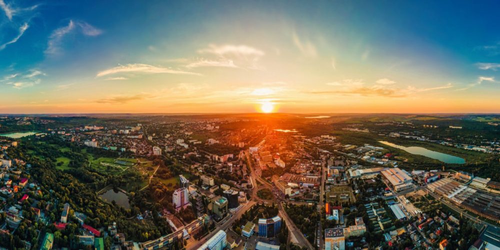aerial drone view chisinau downtown panorama view multiple buildings roads parks scaled